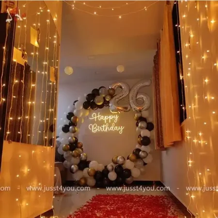 Oval backdrop with 32 inch foil balloons and HBD neon